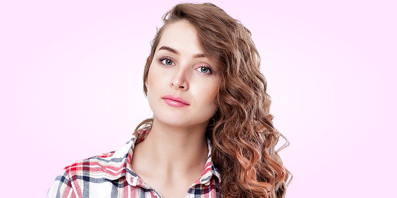 All on one shoulder curly side-swept hairstyle