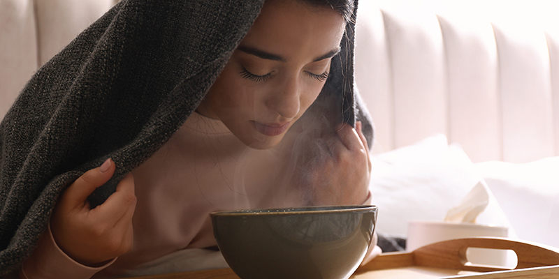 Girl-taking-face-steam-using-towel-and-bowl