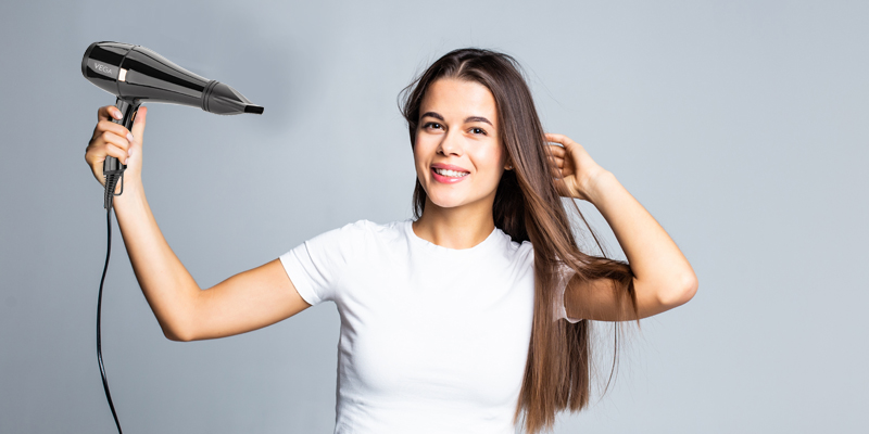Woman-Using-Hair-Dryer