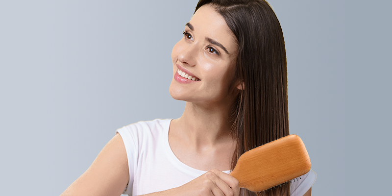 Woman-Using-Vega-Hair-Brush