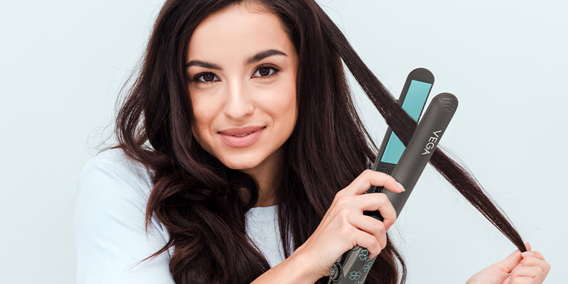  Woman-Using-hair-straightener